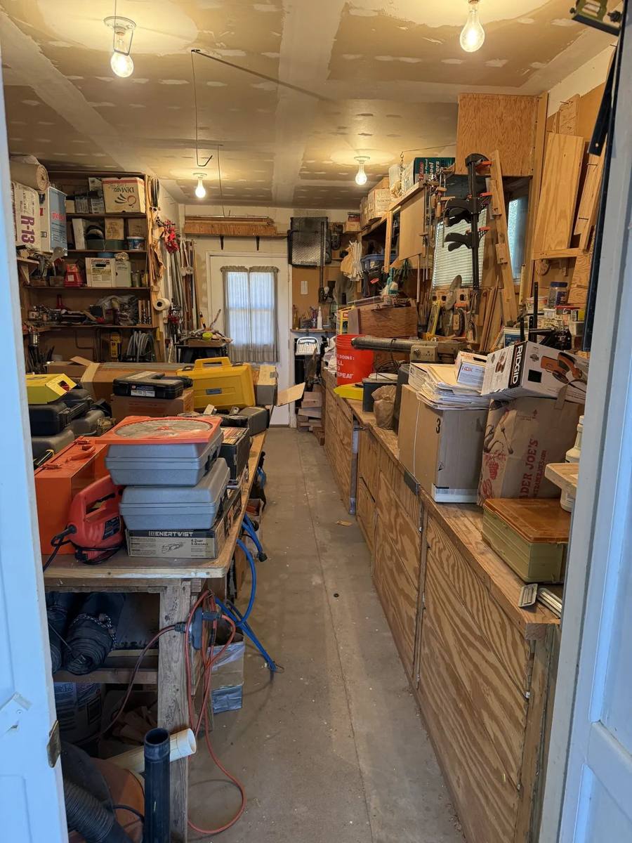 Tools and stored household items in a workshop at one of Taylor Family Store’s Kingman estate sales.